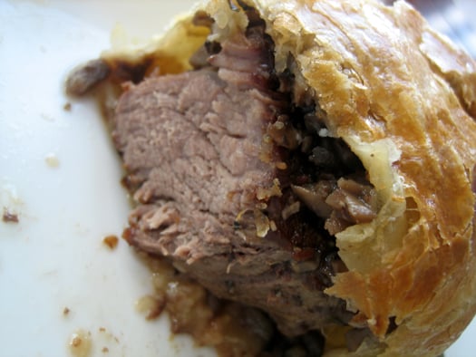 Showing the inside texture of beef Wellington.