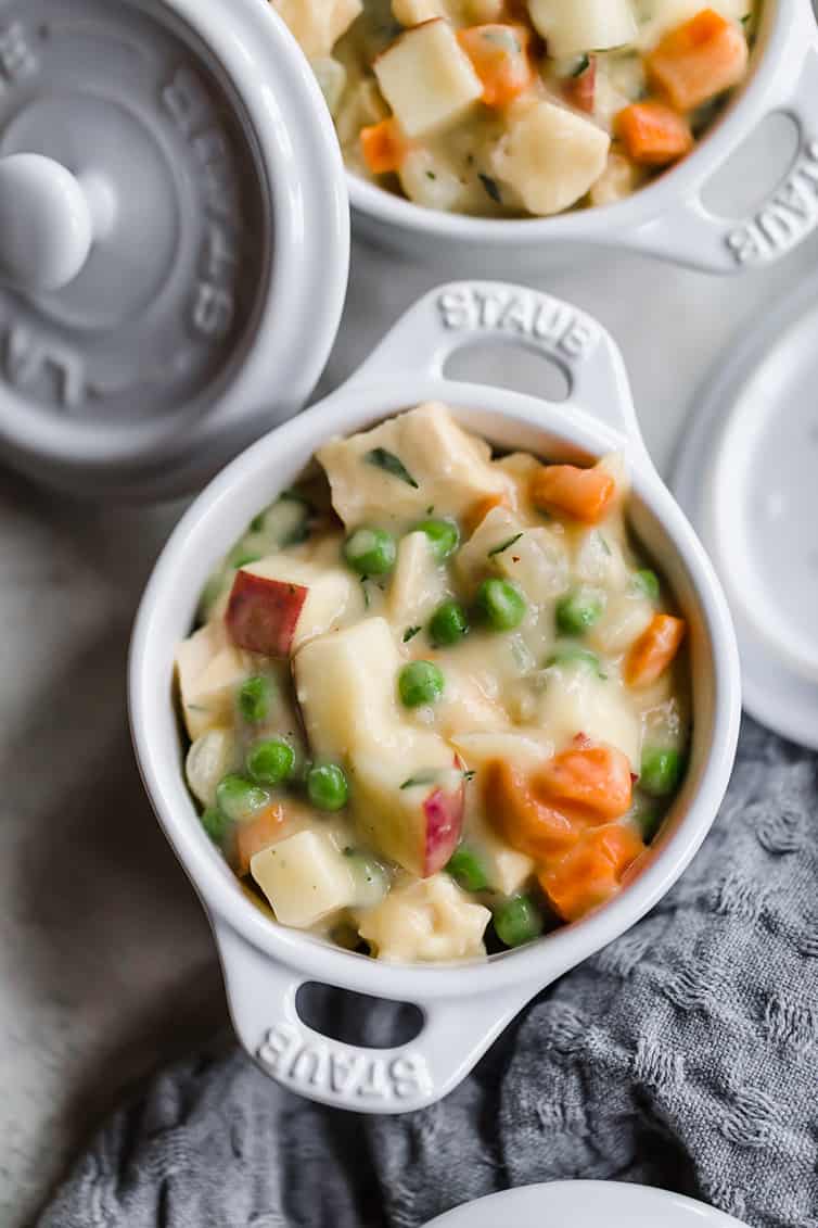Chicken pot pie filling in a ramekin.