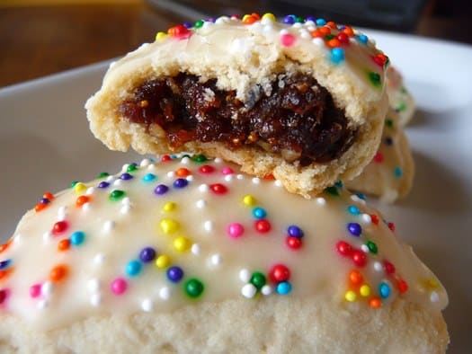Italian fig cookies with a bite taken showing the filling.