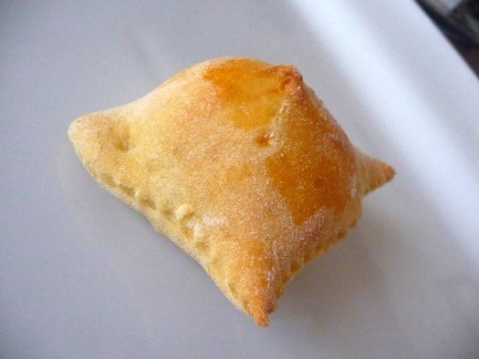 Italian gougeres on a white plate.