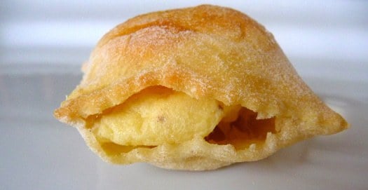 Italian gougeres on a white plate.