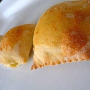 Italian gougeres on a white plate.