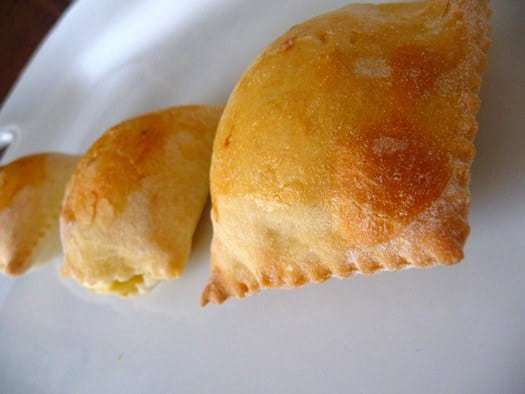 Italian gougeres on a white plate.
