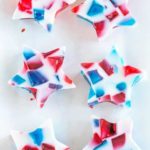 A tray of red, white and blue stained glass Jello stars.