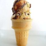 Ice cream cone with 2 scoops of tin roof ice cream.