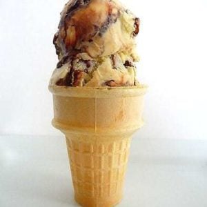 Ice cream cone with 2 scoops of tin roof ice cream.