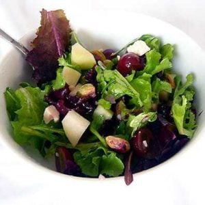 Salad in a white bowl.