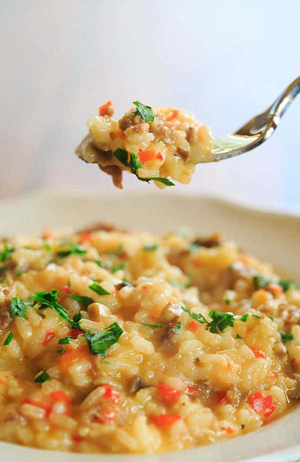 Sausage, Pepper & Mushroom Risotto - A hearty meal that needs only Italian bread and a big salad as an accompaniment! | https://apex-male.info/italian-sausage-red-pepper-and-mushroom-risotto/