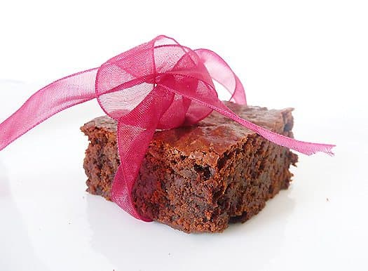 Brownie tied with a pink ribbon.