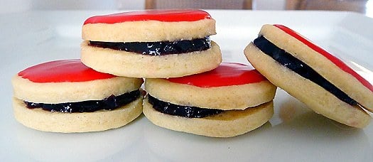 4 empire cookies on a white plate.