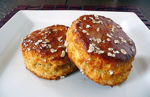 2 maple oatmeal scones on a white plate.