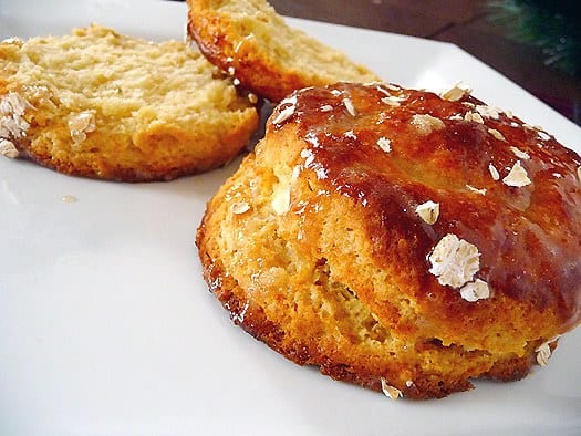 2 maple oatmeal scones on a white plate.