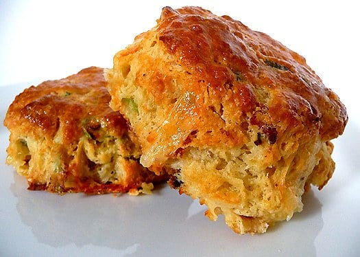 2 quiche lorraine scones on a white plate.