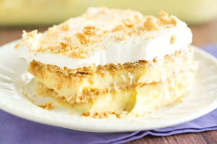 A slice of icebox cake with a big forkful taken out.