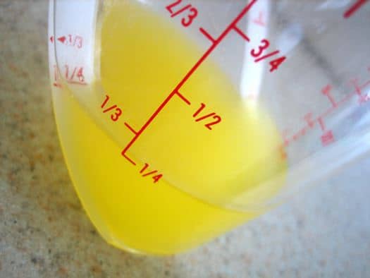 Melted butter in a glass measuring cup.