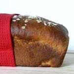 Side view of a loaf of honey oatmeal sandwich bread.