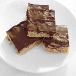 4 Scotcheroos on a white plate.