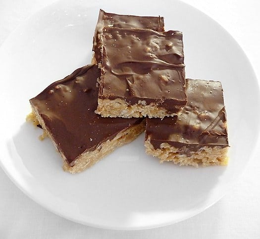 4 Scotcheroos on a white plate.