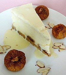 Slice of fig and almond cheesecake on a white plate.
