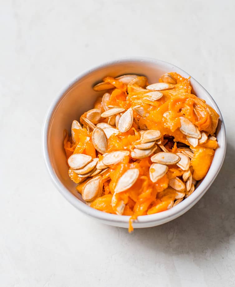 A bowl of the butternut squash seeds and scrapings.