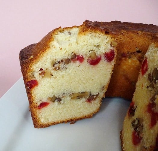 Side view of Russian pound cake with a slice removed showing the inside texture and layers.
