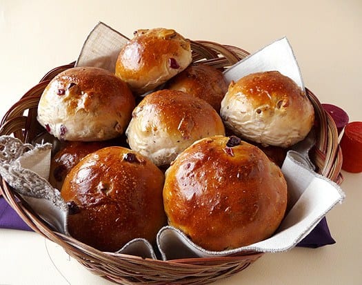 Cranberry walnut rolls in a basket.