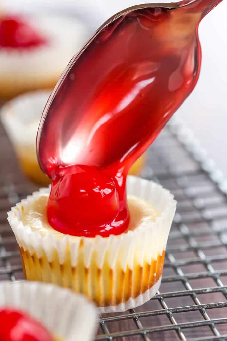 These easy mini cheesecakes have been a holiday staple in my family forever! Nilla wafers are topped with cheesecake batter and cherry pie filling. A perfect bite-size treat!