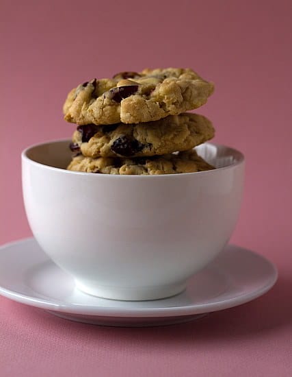 Cranberry white chocolate chip cookies in a white bowl.