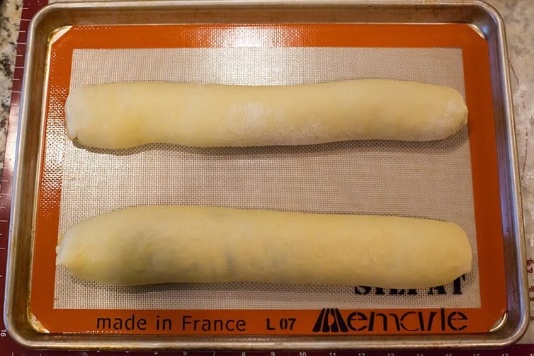 Assembled nut roll on baking sheet.