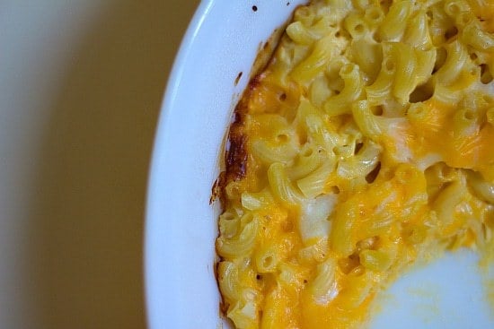 Overhead image of baked macaroni and cheese in a white baking dish.