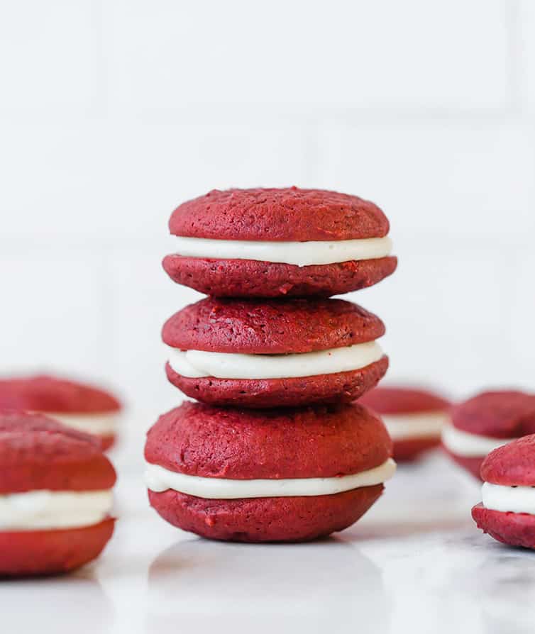 A stack of three red velvet whoopie pies.