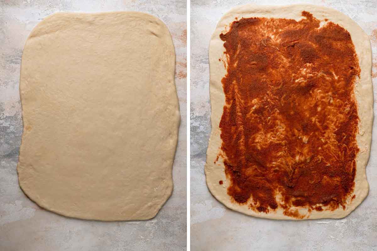 King cake dough rolled out and cinnamon sugar filling spread over the surface.