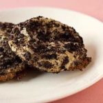 2 Oreo cheesecake cookies on a white plate.