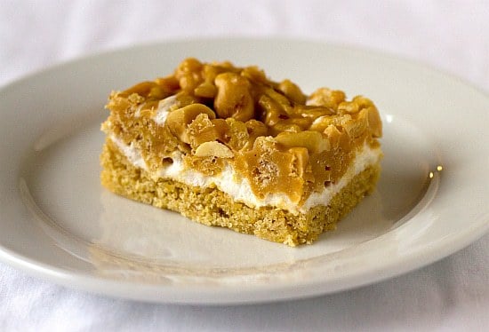 One salted peanut chew bar on a white plate.