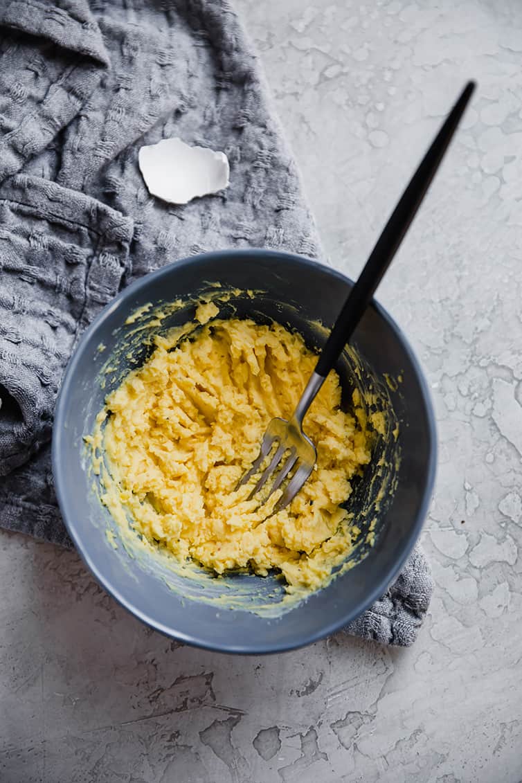 The filling for deviled eggs in a bowl.