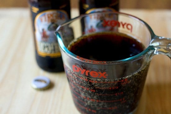 Root beer in a glass measuring cup.