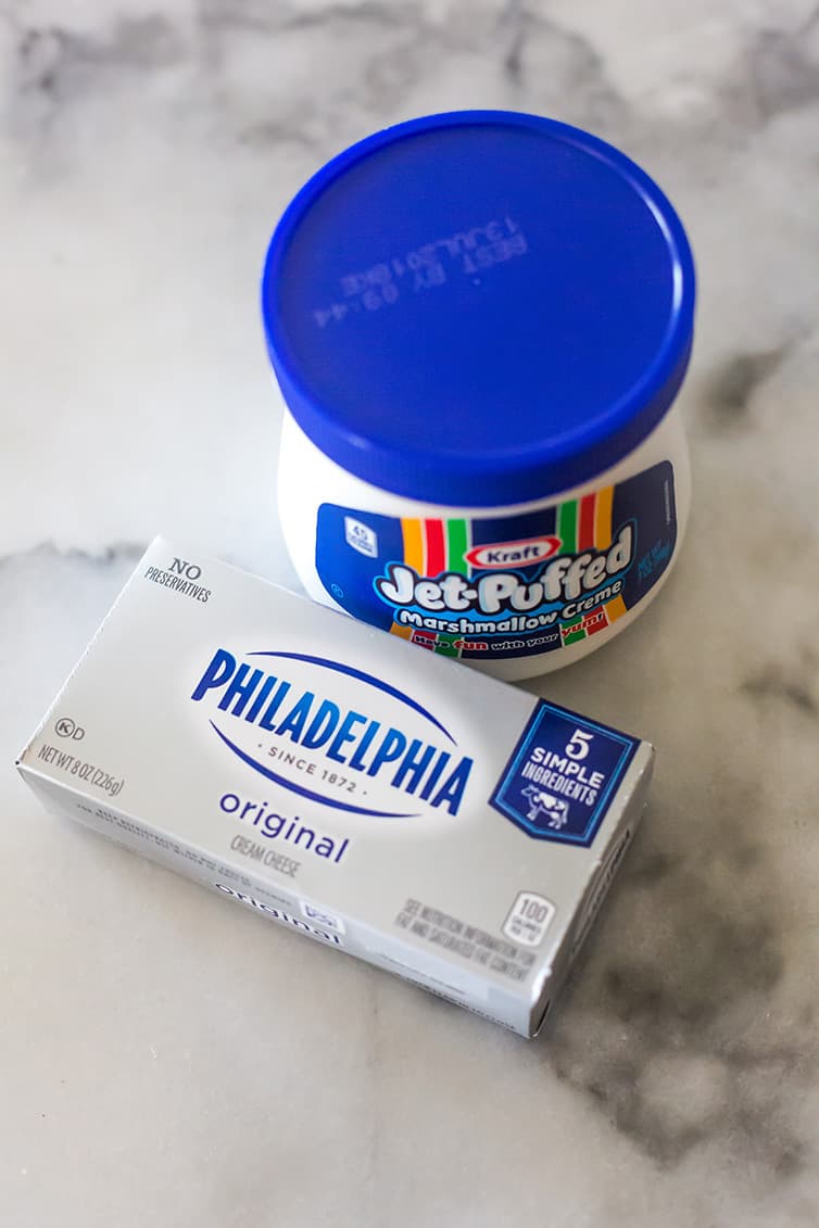 A block of Philadelphia cream cheese with a jar of marshmallow creme.