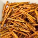 French fries on a white serving platter.