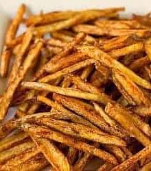 French fries on a white serving platter.