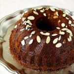 Honey Bundt cake on a silver serving platter.