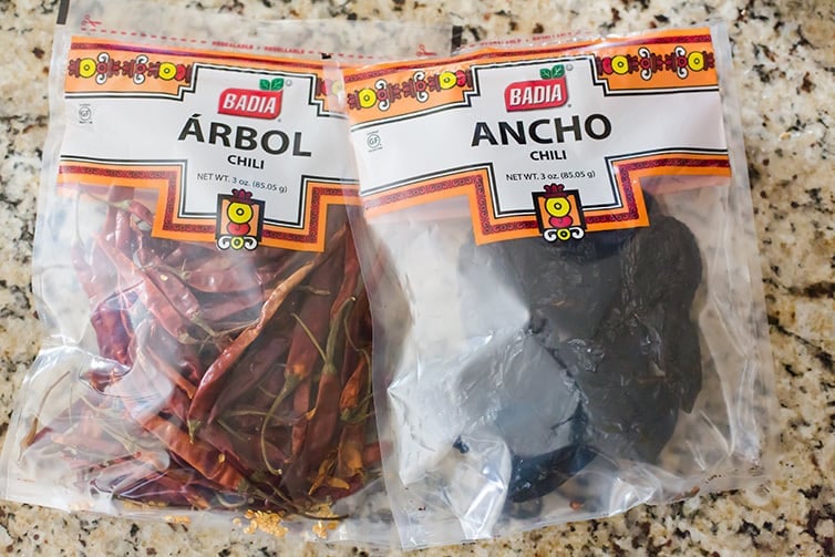 Bags of dried ancho and dried arbol chiles.