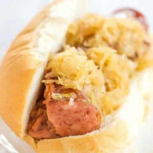 This slow cooker kielbasa and sauerkraut is flavorful and made with just the addition of beer and brown sugar - easy, delicious and perfect for parties!
