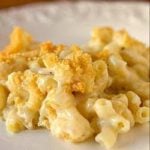 A serving of macaroni and cheese casserole on a white plate.