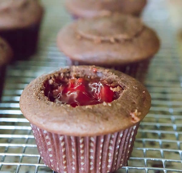 Cherry Coke Float Cupcakes - Chocolate cupcakes made with Coca-Cola, filled with cherries, topped with a Coca-Cola glaze, a whipped cream frosting and cherry on top!