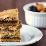 Stack of 3 fig bars on a white plate.