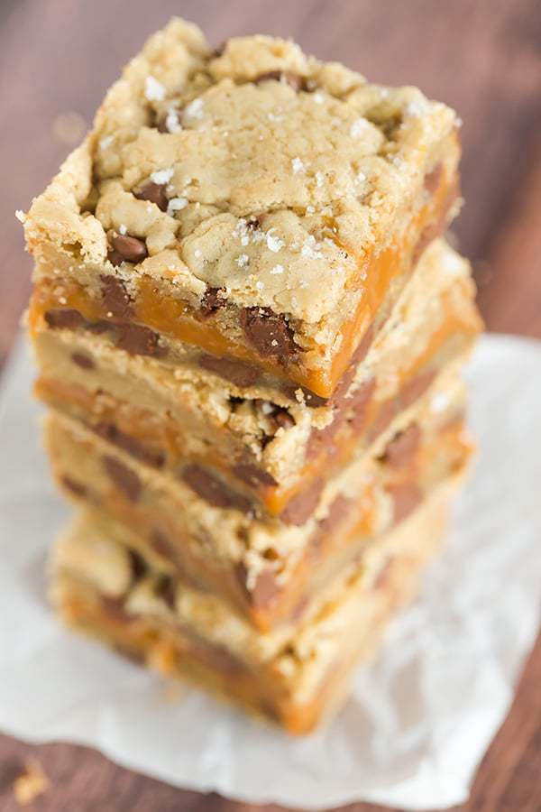Salted Caramel Chocolate Chip Cookie Bars - A layer of salted caramel sauce is sandwiched between layers of a favorite chocolate chip cookie dough recipe, then topped with a sprinkle of fleur de sel.