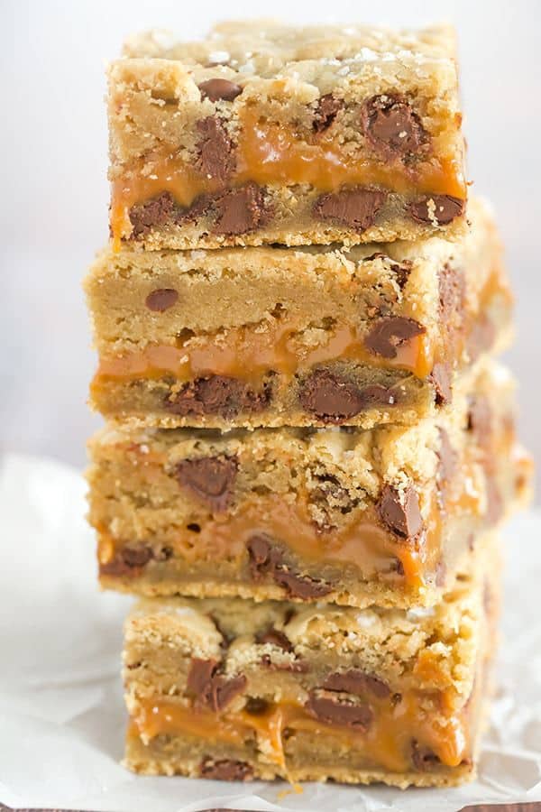 Salted Caramel Chocolate Chip Cookie Bars - A layer of salted caramel sauce is sandwiched between layers of a favorite chocolate chip cookie dough recipe, then topped with a sprinkle of fleur de sel.
