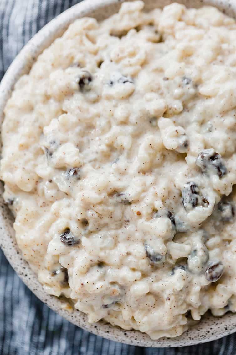 A close up photo of a bowl of rice pudding.