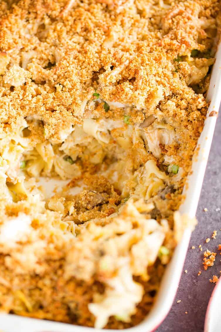 An overhead shot of a pan of turkey tetrazzini with a spoonful removed.