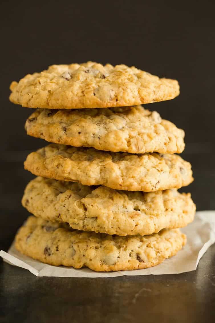 A big stack of five oatmeal chocolate chip cookies.